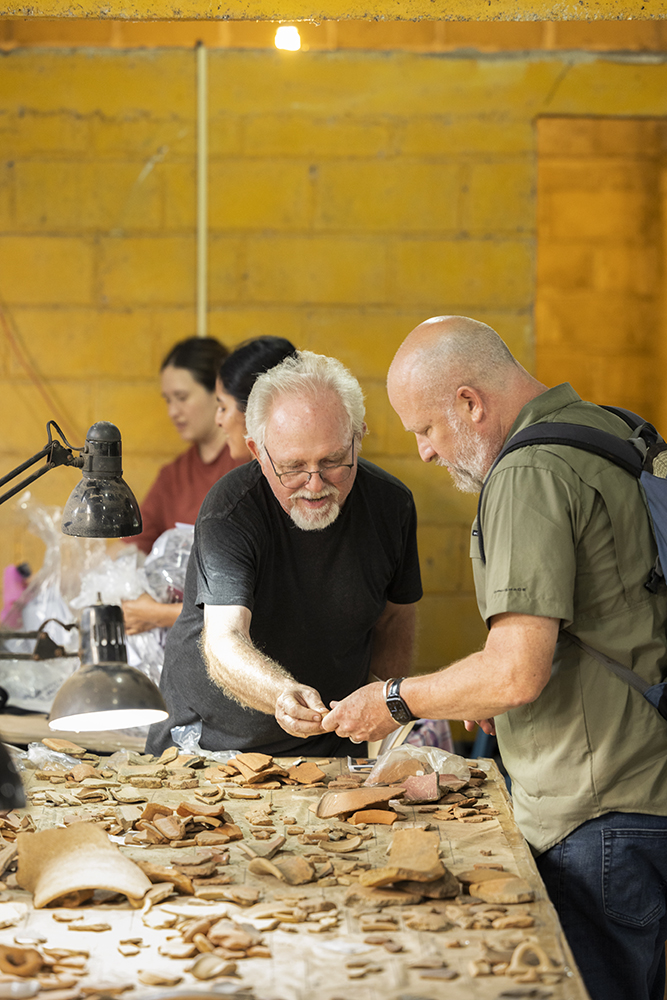 Archaeologists Christopher Pool, left, and Carl Wendt analyze pottery remains in the Tres Zapotes laboratory.